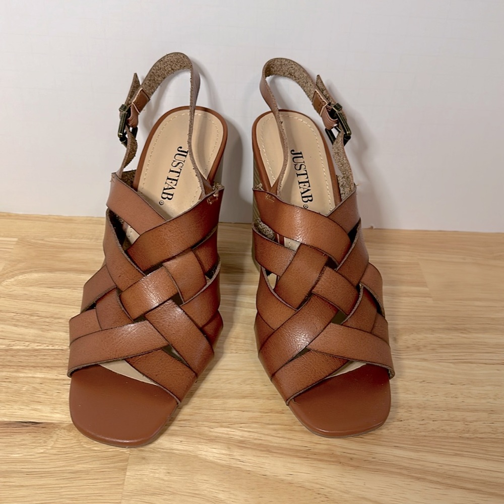 Justfab NWOT size 7.5 man made woven leather sandals with 4 inch heels.